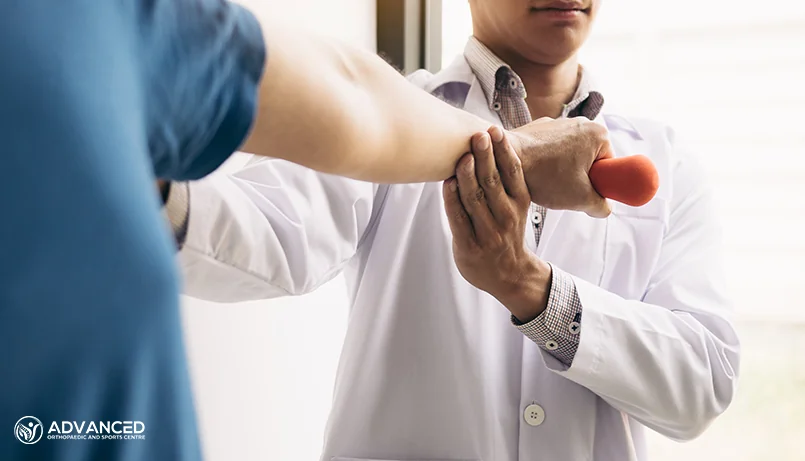 an orthopaedic doctor in singapore checking a patient